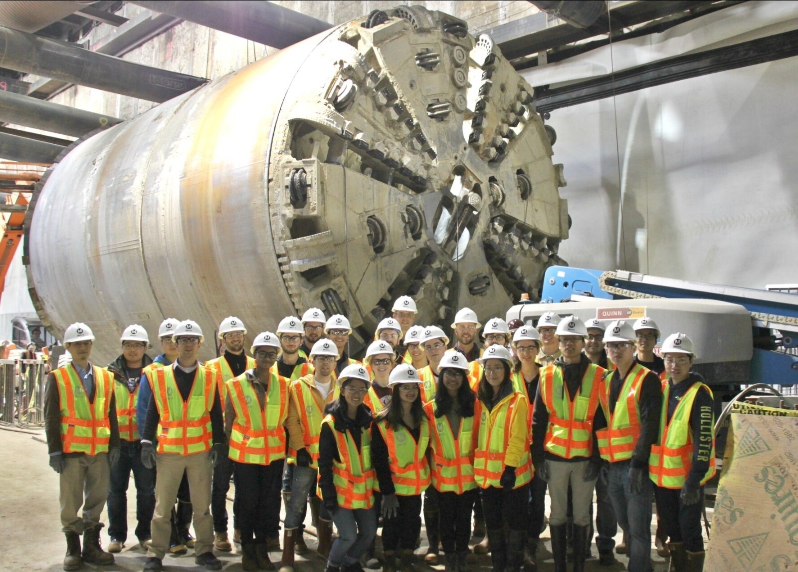 Photo of Team in front of Tunnel Boring Machine